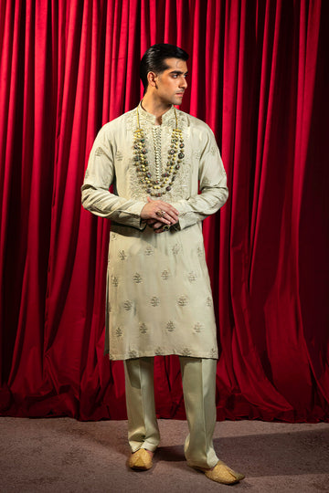 Designer pastel green kurta with waistcoat available online in Pakistan, featuring intricate embroidery and premium fabric, perfect for festive and formal occasions.